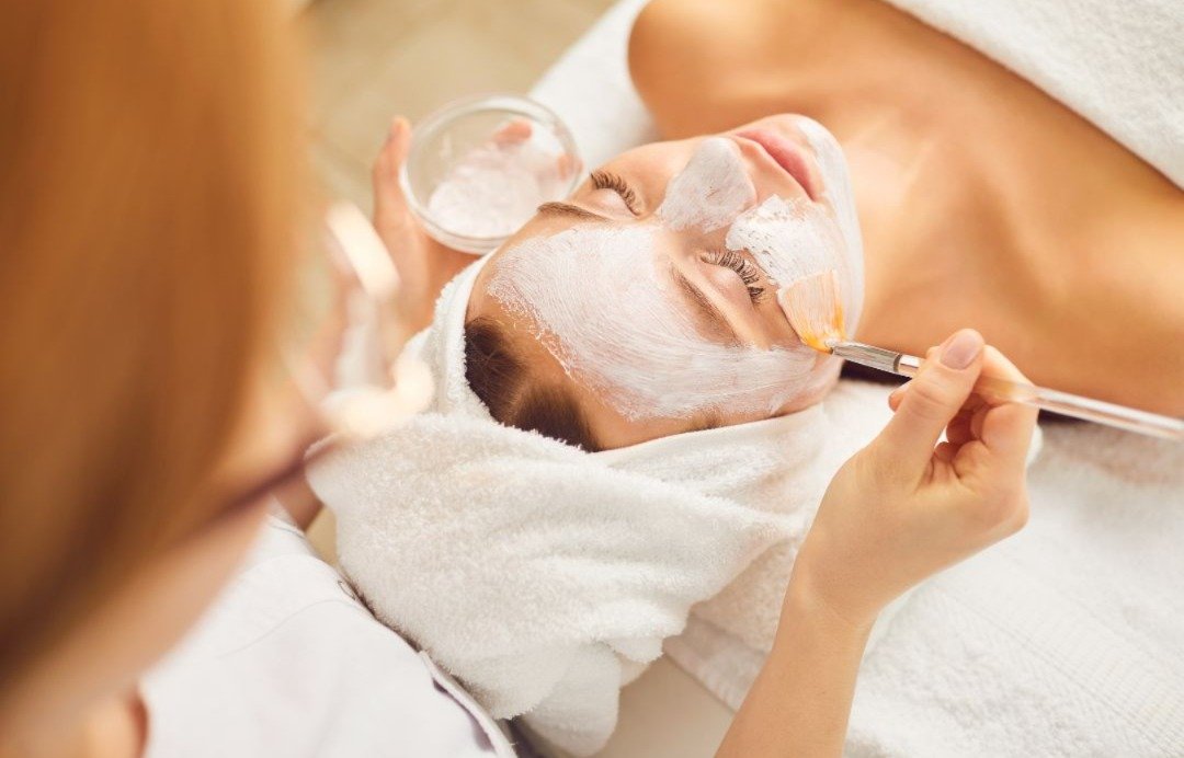 A woman undergoing chemical peel treatment